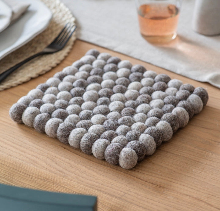 Grey Felt Southwold Square Trivet by Garden Trading, featuring soft felt material and a modern square design for protecting surfaces.