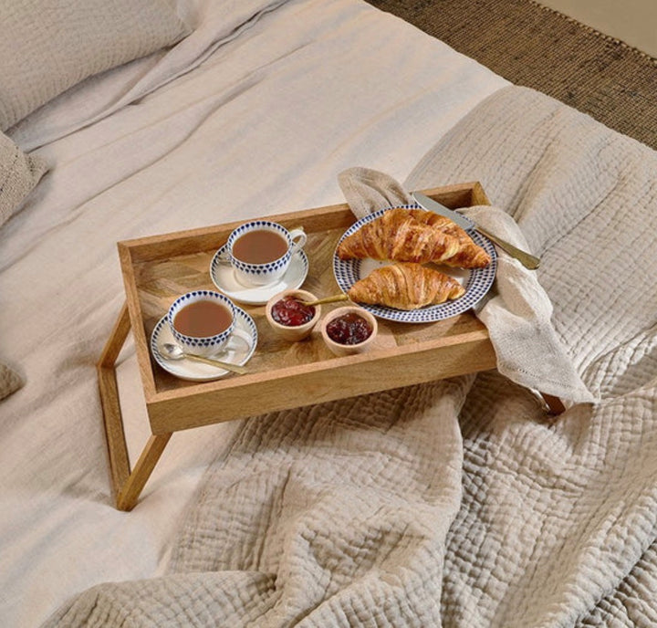 Nkuku Pawi mango wood breakfast tray with handles, natural finish, perfect for serving breakfast in bed or at the table.