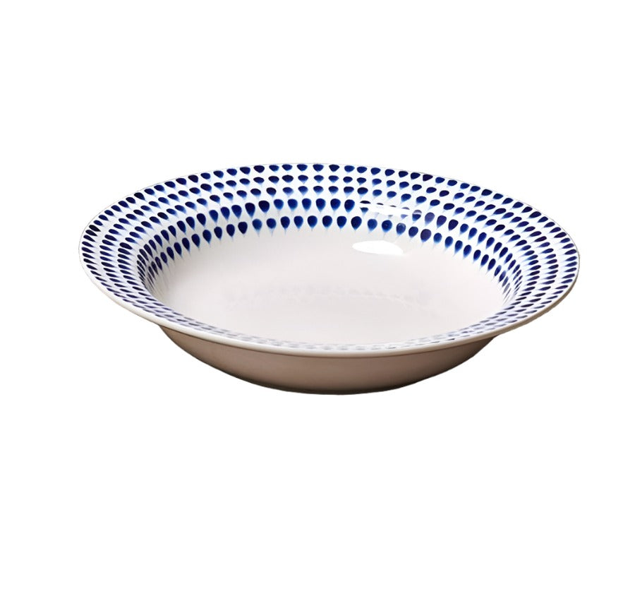 Indigo Drop Pasta Bowl by Nkuku featuring a vibrant blue ceramic design, perfect for serving pasta or salads.