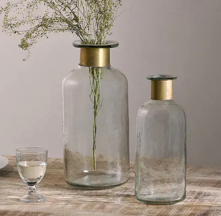 Nkuku Chara hammered small bottle vase with textured, hammered metal finish, ideal for decorative floral arrangements.