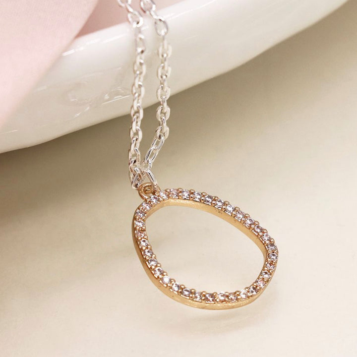 Oval necklace with sparkling crystals by POM Jewellery, featuring a delicate chain and elegant crystal embellishments.