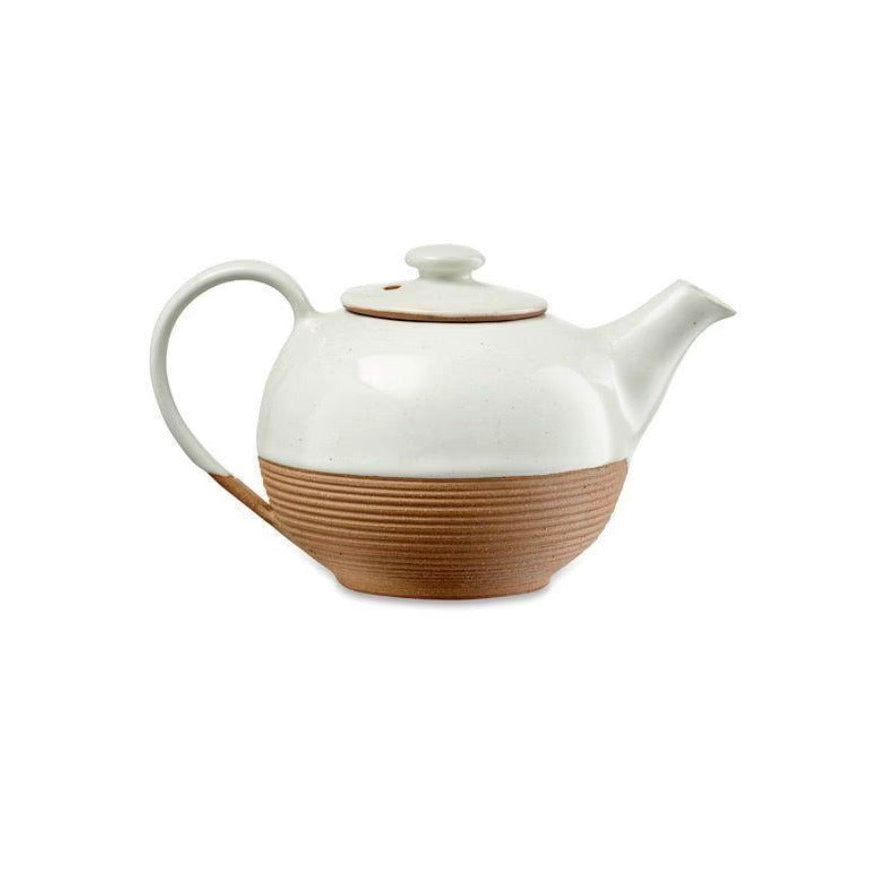 White and terracotta Mali ribbed teapot by Cornucopia Home and Gift, featuring a textured ribbed design and a rounded spout.