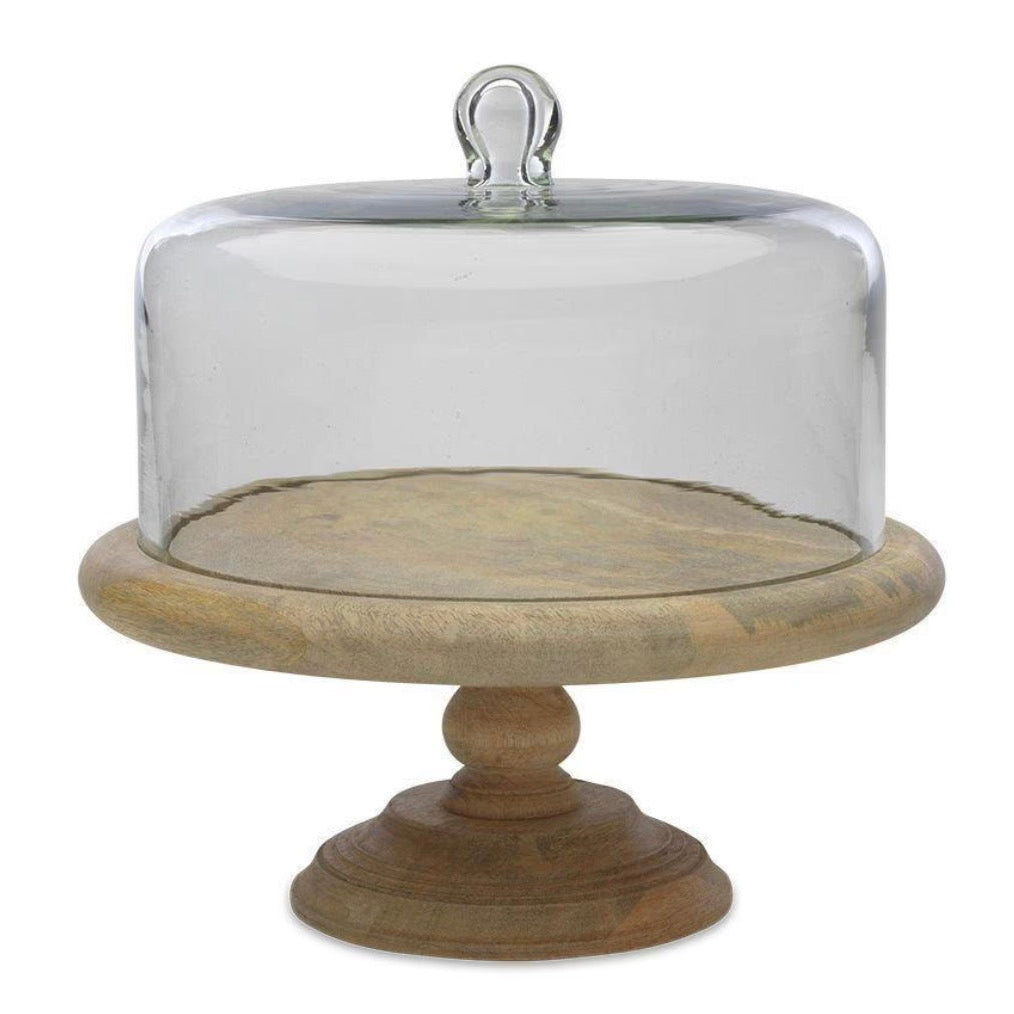 Recycled glass dome cake stand by Nkuku featuring a clear glass cover and base, perfect for displaying baked goods.