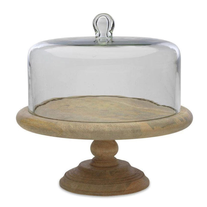 Recycled glass dome cake stand by Nkuku featuring a clear glass cover and base, perfect for displaying baked goods.