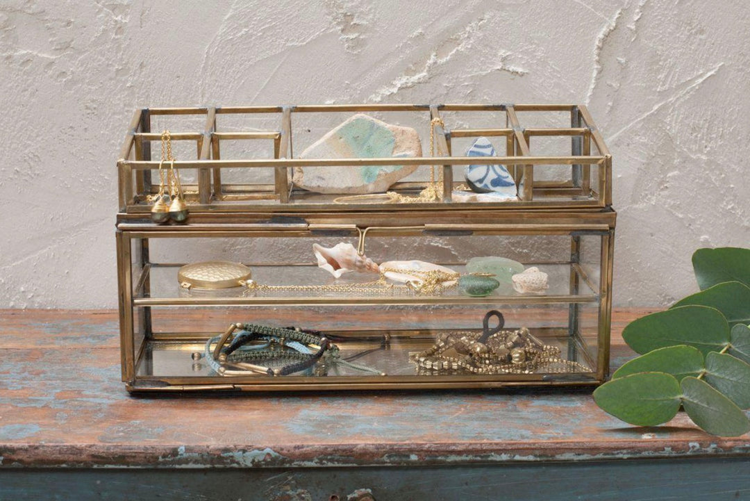 Antique brass Nkuku Bequai open jewelry box with intricate detailing and a vintage-inspired design for storing jewelry.