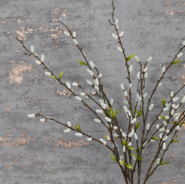 Cream-colored faux pussy willow stem from Floralsilk by Cornucopia Home and Gift, with soft catkin buds on a natural branch.
