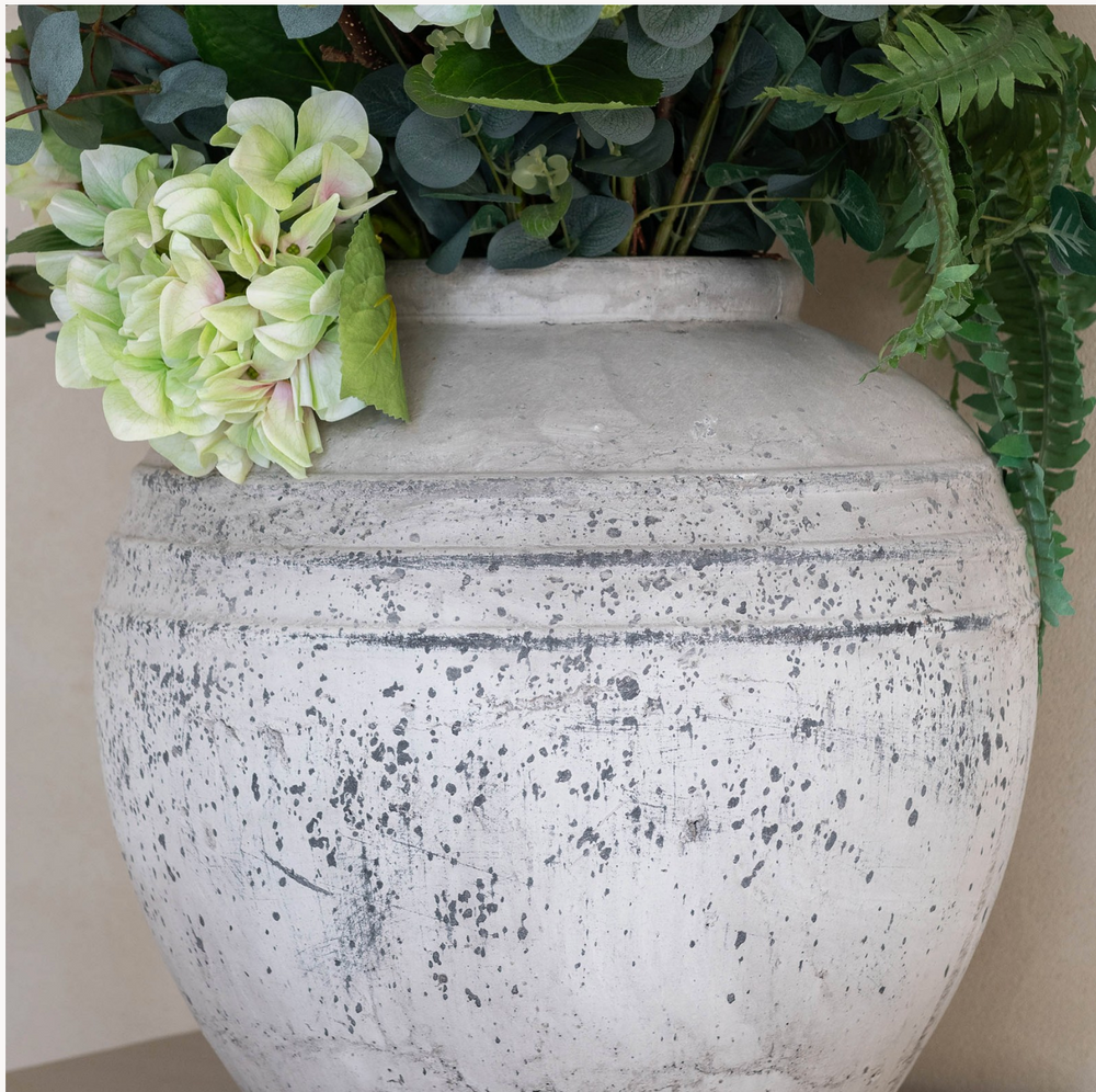 Round Birkdale stone pot by Cornucopia Home and Gift, featuring a textured, natural stone finish and a smooth, rounded shape.