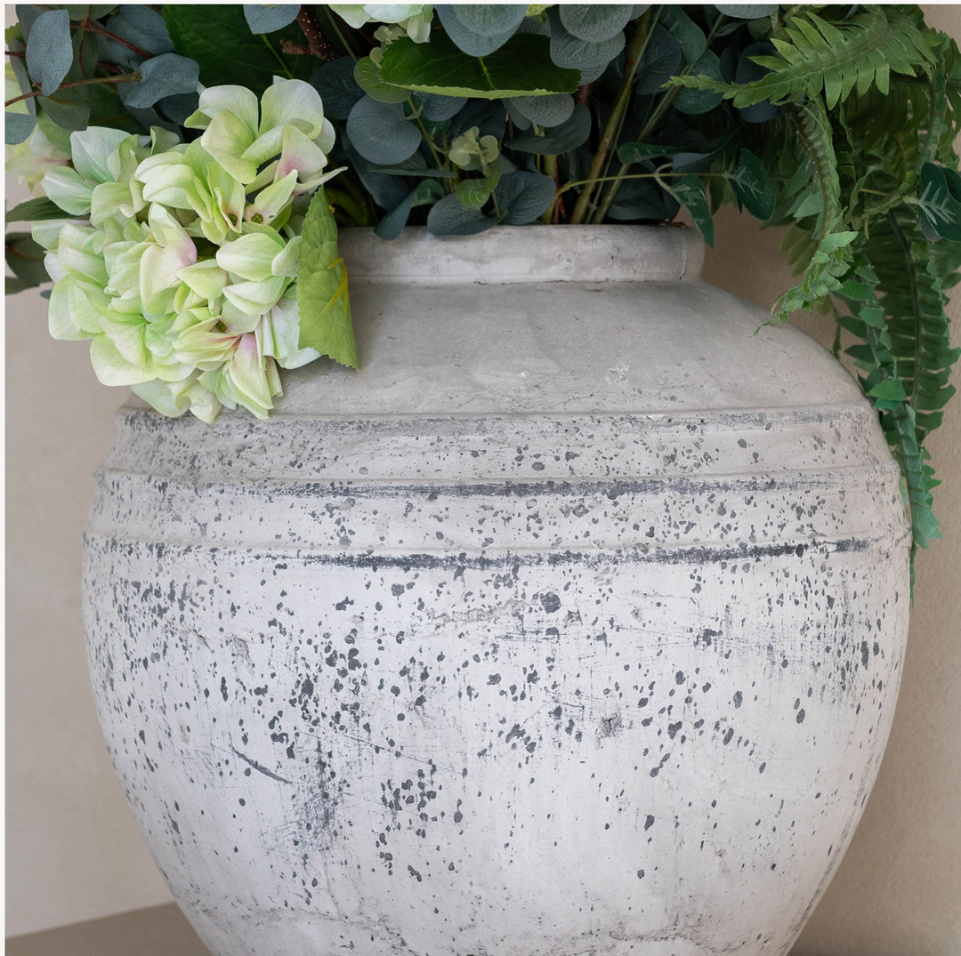 Round Birkdale stone pot by Cornucopia Home and Gift, featuring a textured, natural stone finish and a smooth, rounded shape.