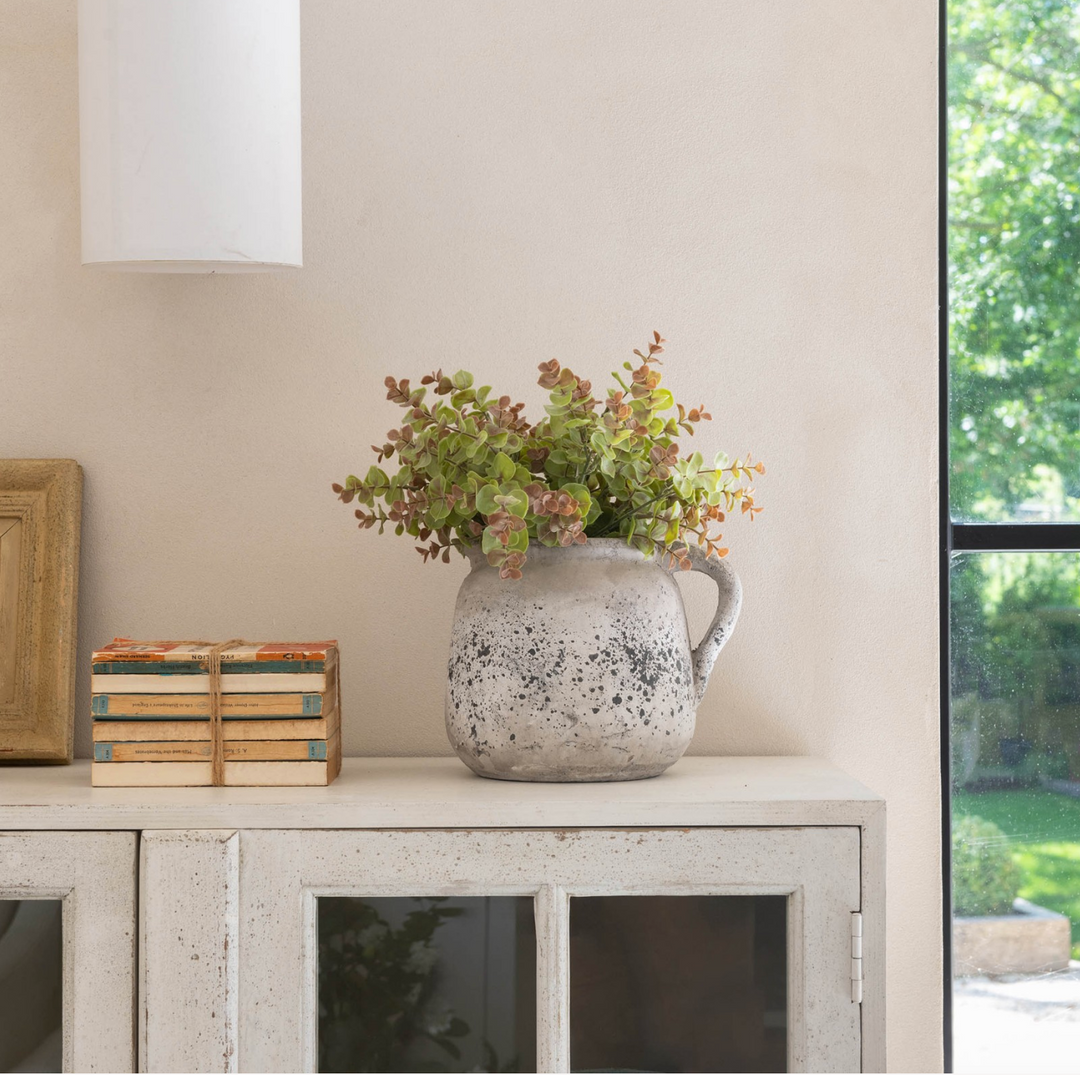 Small stone jug from the Birkdale collection by Cornucopia Home and Gift, featuring a rustic, textured design perfect for home decor.