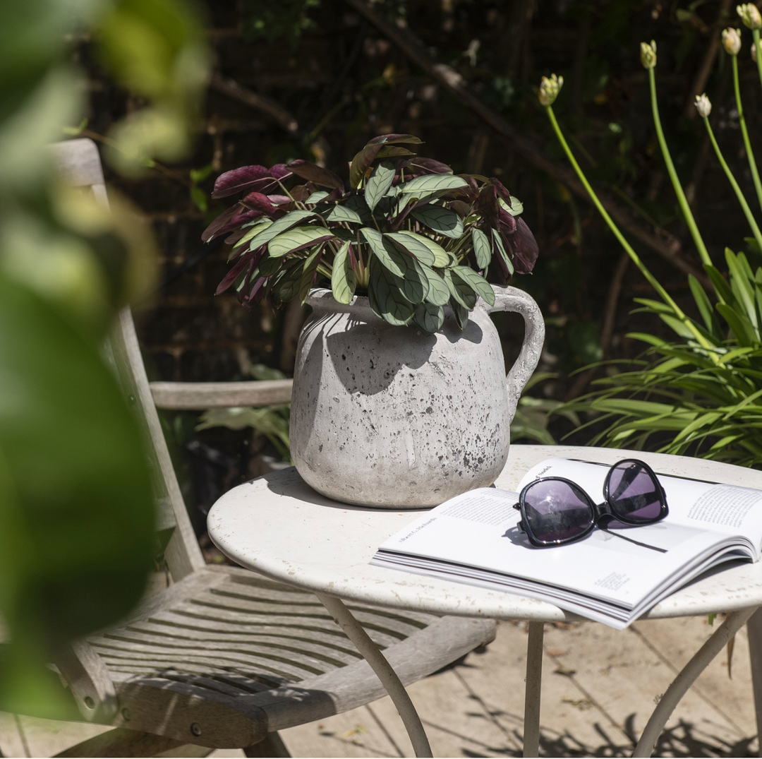 Small stone jug from the Birkdale collection by Cornucopia Home and Gift, featuring a rustic, textured design.