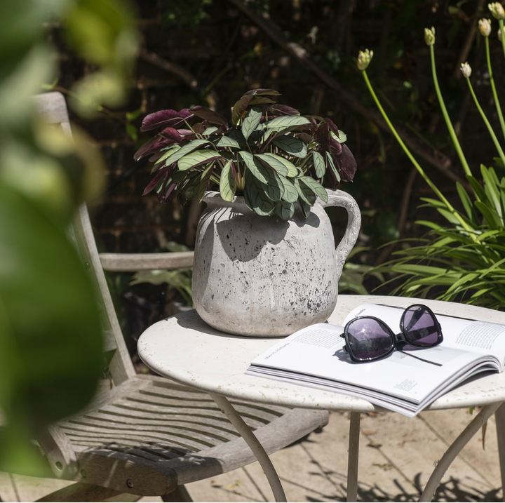Small stone jug from the Birkdale collection by Cornucopia Home and Gift, featuring a rustic, textured design.