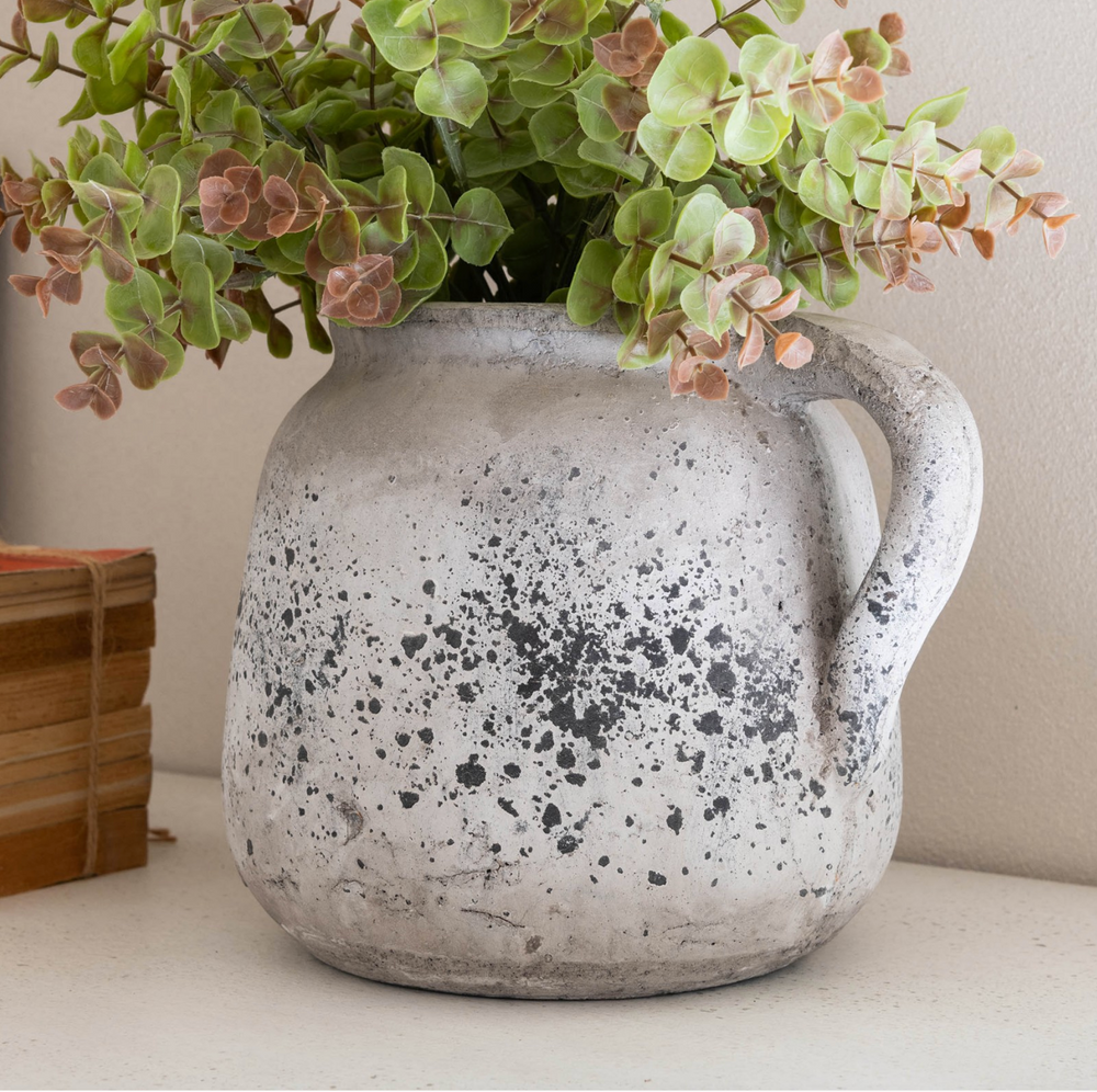 Small stone jug from Birkdale collection by Cornucopia Home and Gift, showcasing a rustic, textured ceramic design.