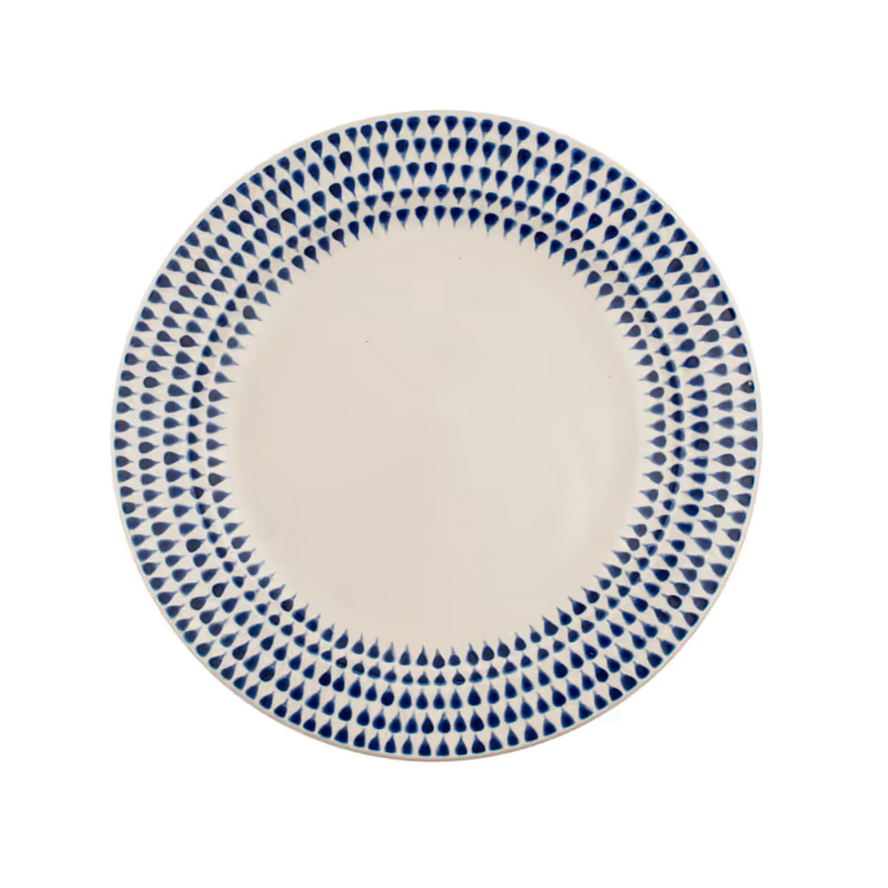 Indigo drop side plate by Nkuku featuring a handcrafted ceramic design with blue and white glaze details.