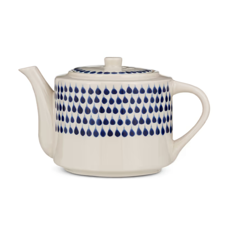 Indigo Drop Teapot by Nkuku featuring a ceramic body and elegant handle, perfect for serving tea in a stylish kitchen setting.