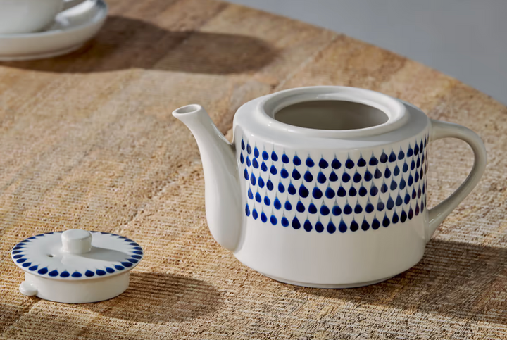 Indigo Drop Teapot by Nkuku, ceramic kitchenware with a smooth, rounded design and a matching lid, ideal for tea brewing.