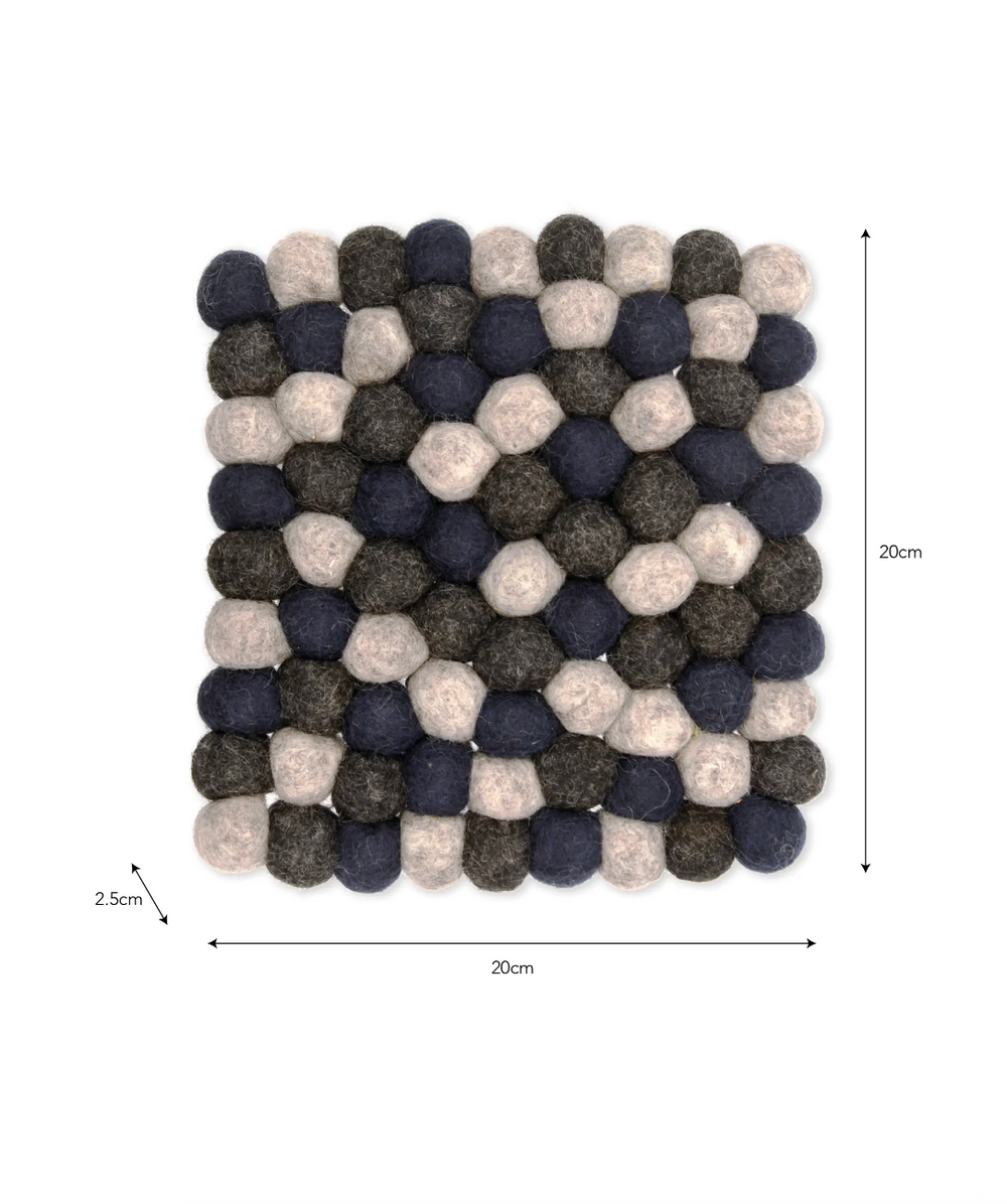 Garden Trading Southwold Trivet in Ink, round ceramic hot pad with textured pattern for protecting surfaces, by Cornucopia Home and Gift.