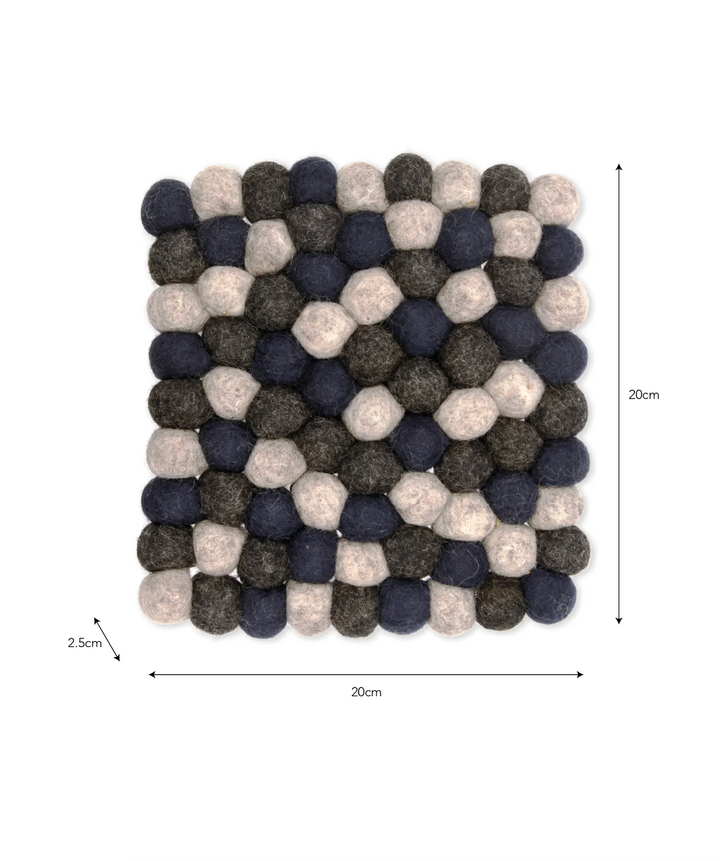 Garden Trading Southwold Trivet in Ink, round ceramic hot pad with textured pattern for protecting surfaces, by Cornucopia Home and Gift.