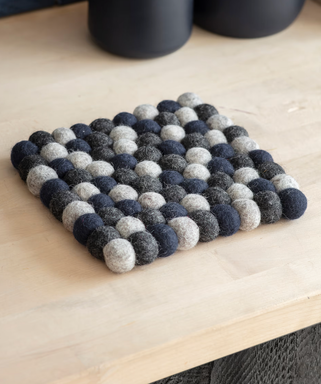 Southwold Trivet in ink color by Garden Trading, featuring a stylish ceramic design perfect for protecting surfaces.
