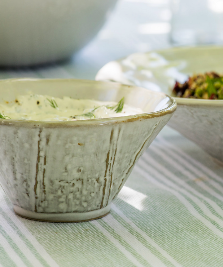 White Ithaca Meze Bowl with Spoon from Garden Trading, ideal for serving small dishes in a stylish kitchen setting.