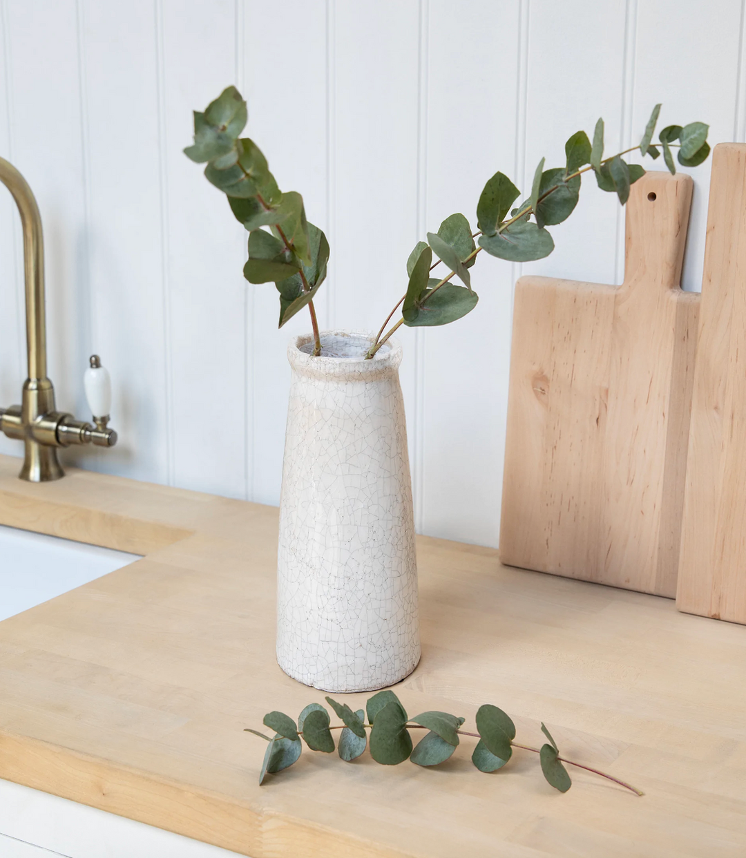 White Ravello Bottle Vase by Garden Trading, featuring a sleek, narrow-neck design ideal for floral arrangements.