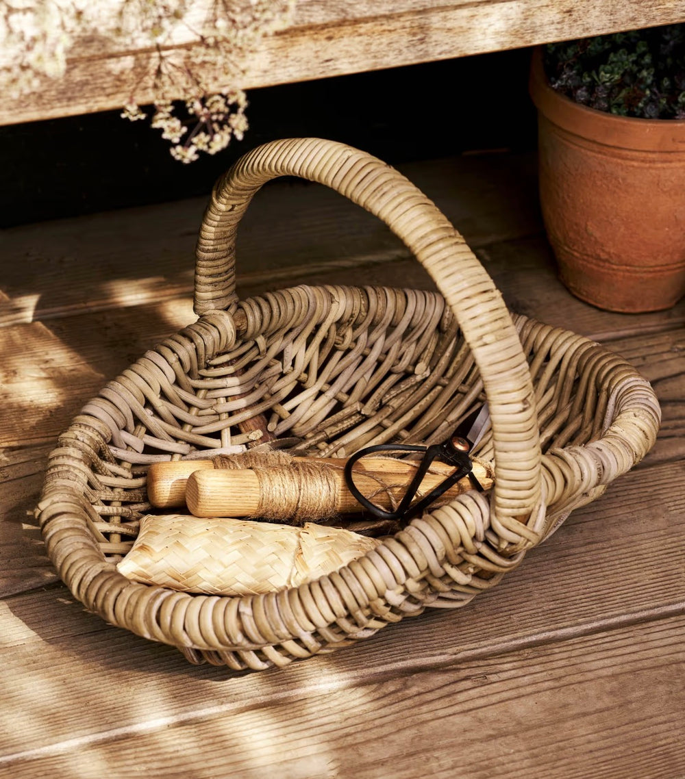 Small rattan trug basket by Garden Trading, perfect for garden or home organization, with a woven natural finish.
