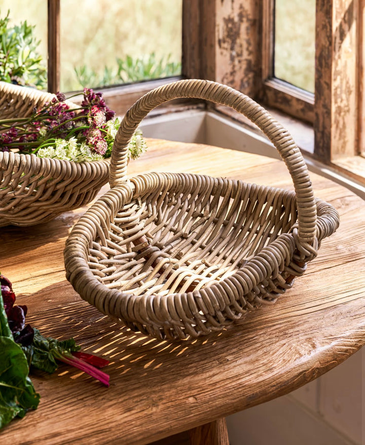 Small rattan trug basket by Garden Trading, perfect for garden or home decor, with a natural woven rattan design.