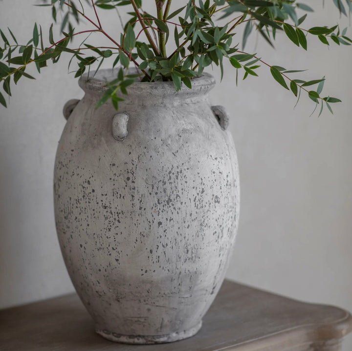Cornucopia Home and Gift Avebury stone urn with handles, featuring a classic, weathered design suitable for outdoor or garden decor.