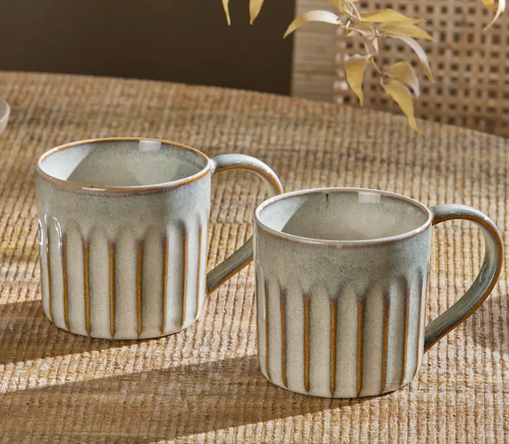 Set of two Nkuku Moda Natural mugs with simple, elegant design, perfect for coffee or tea, by Cornucopia Home and Gift.