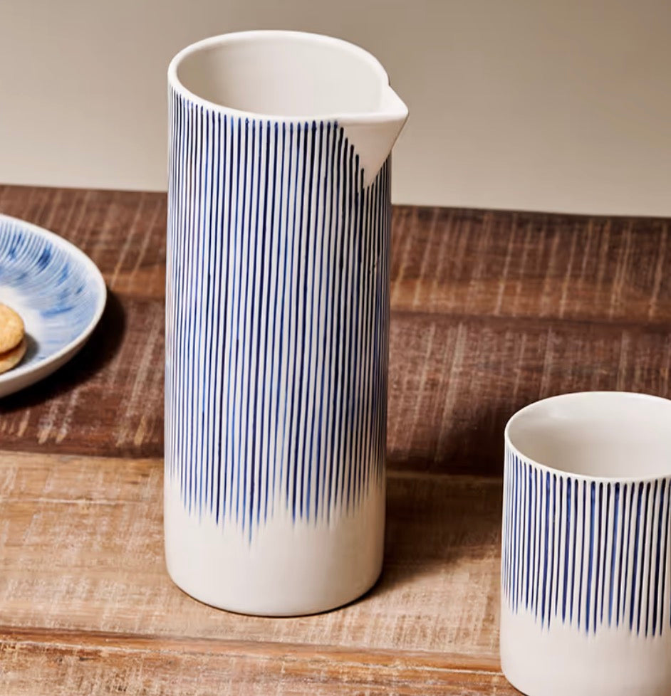 Nkuku Karuma ceramic jug with a smooth, rounded design, featuring a natural earthy finish and a sturdy handle.