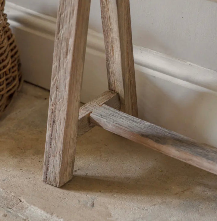 Nkuku Ibo Long Bench made of reclaimed wood, showcasing a rustic, handcrafted wooden seating piece with natural grain details.