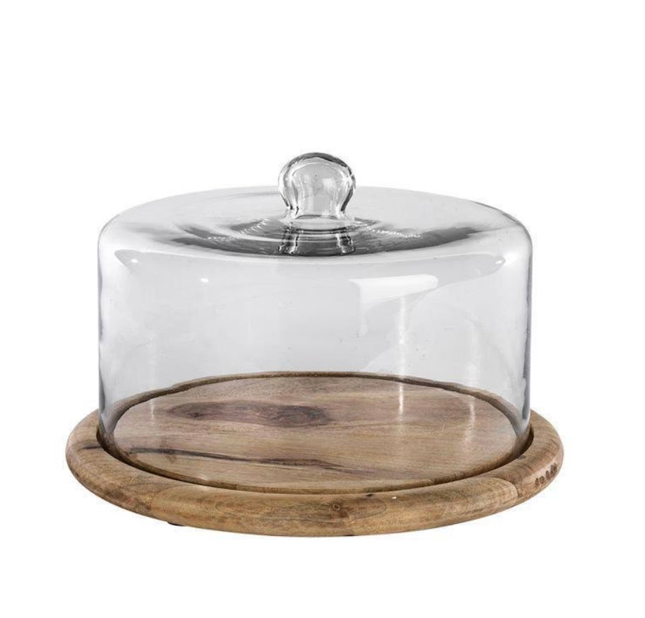 Recycled glass cake dome by Nkuku featuring a clear, rounded cover and sturdy base, perfect for displaying baked goods gracefully.