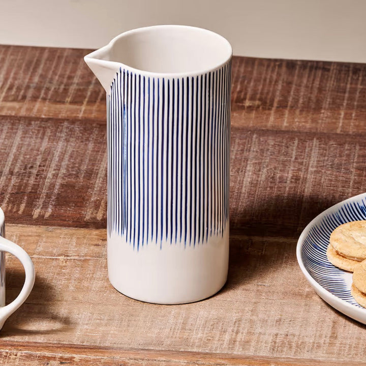 Small Nkuku Karuma ceramic jug with a smooth, rounded shape and earthy tones, perfect for decorative or functional use.