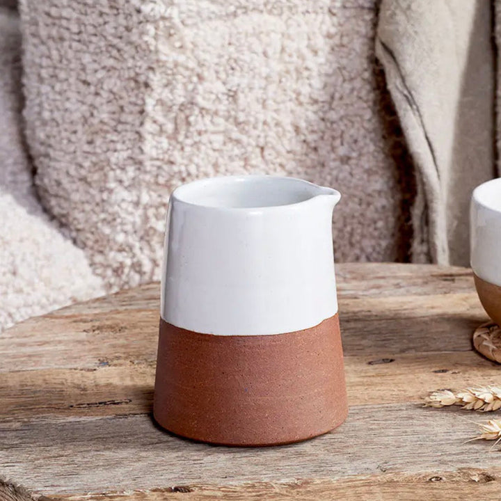 White Nkuku Mali slanting jug with a sleek, modern design, ideal for serving or decorative display.