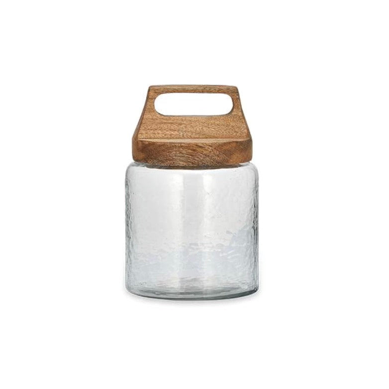 Small Nkuku Kitto Storage Jar with a clear glass body and wooden lid, ideal for kitchen or pantry organization.