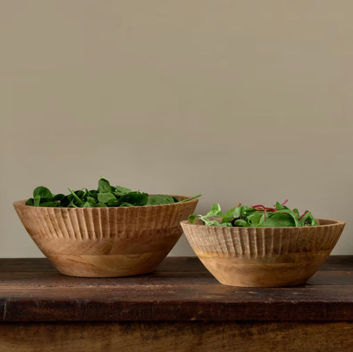 Small Nkuku Gavivi mango wood bowl in natural finish, showcasing smooth, handcrafted design perfect for serving or decorative use.