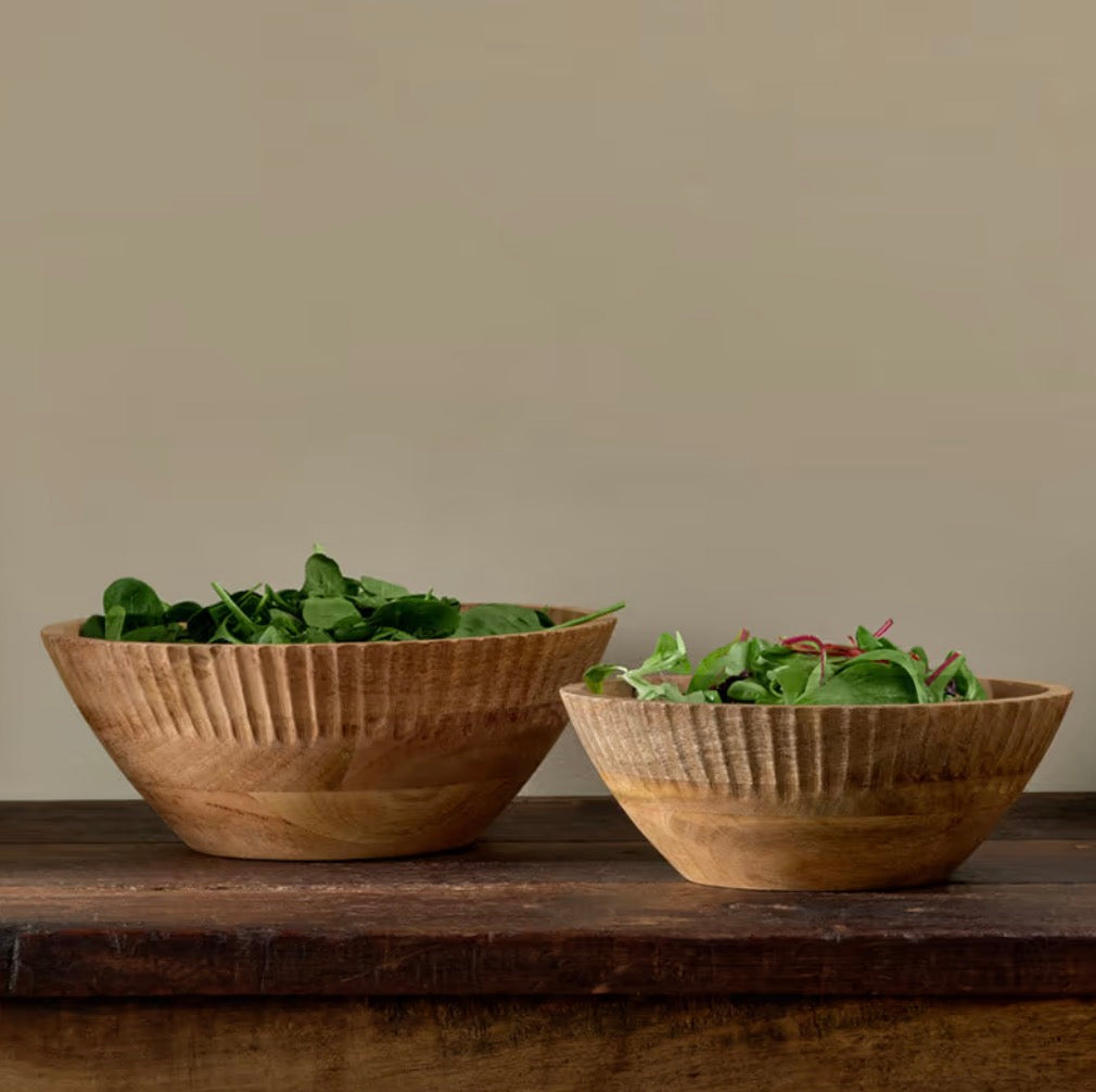 Large natural Mango Wood Bowl by Nkuku, with a smooth, polished finish, showcasing its warm wood grain and handcrafted details.