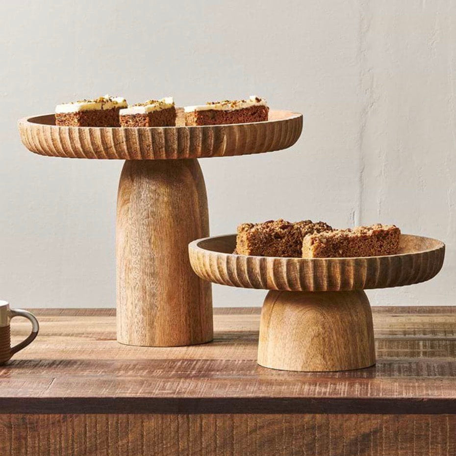 Large natural mango wood stand by Nkuku, featuring a sturdy, handcrafted design ideal for displaying or supporting home decor.