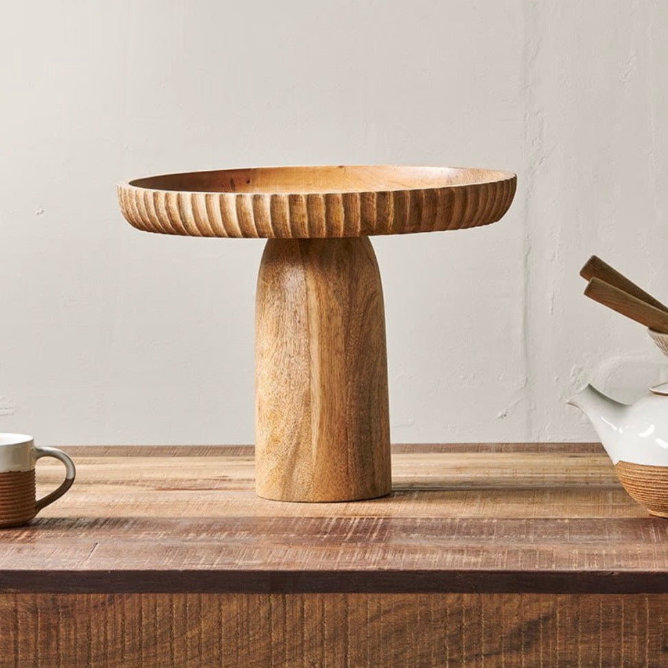 Large natural mango wood stand by Nkuku, perfect for displaying or supporting home decor, with a rustic, textured finish.