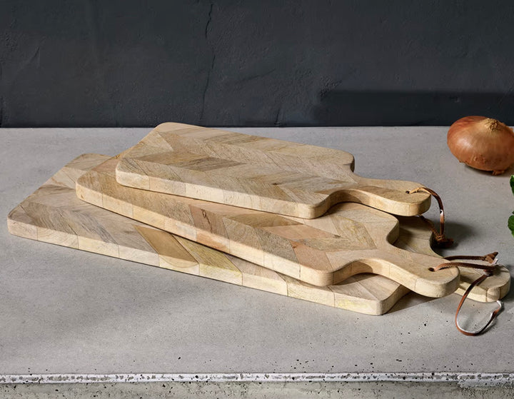 Nkuku Nalbari chopping board made of wood, with a smooth surface and natural finish, ideal for kitchen prep.