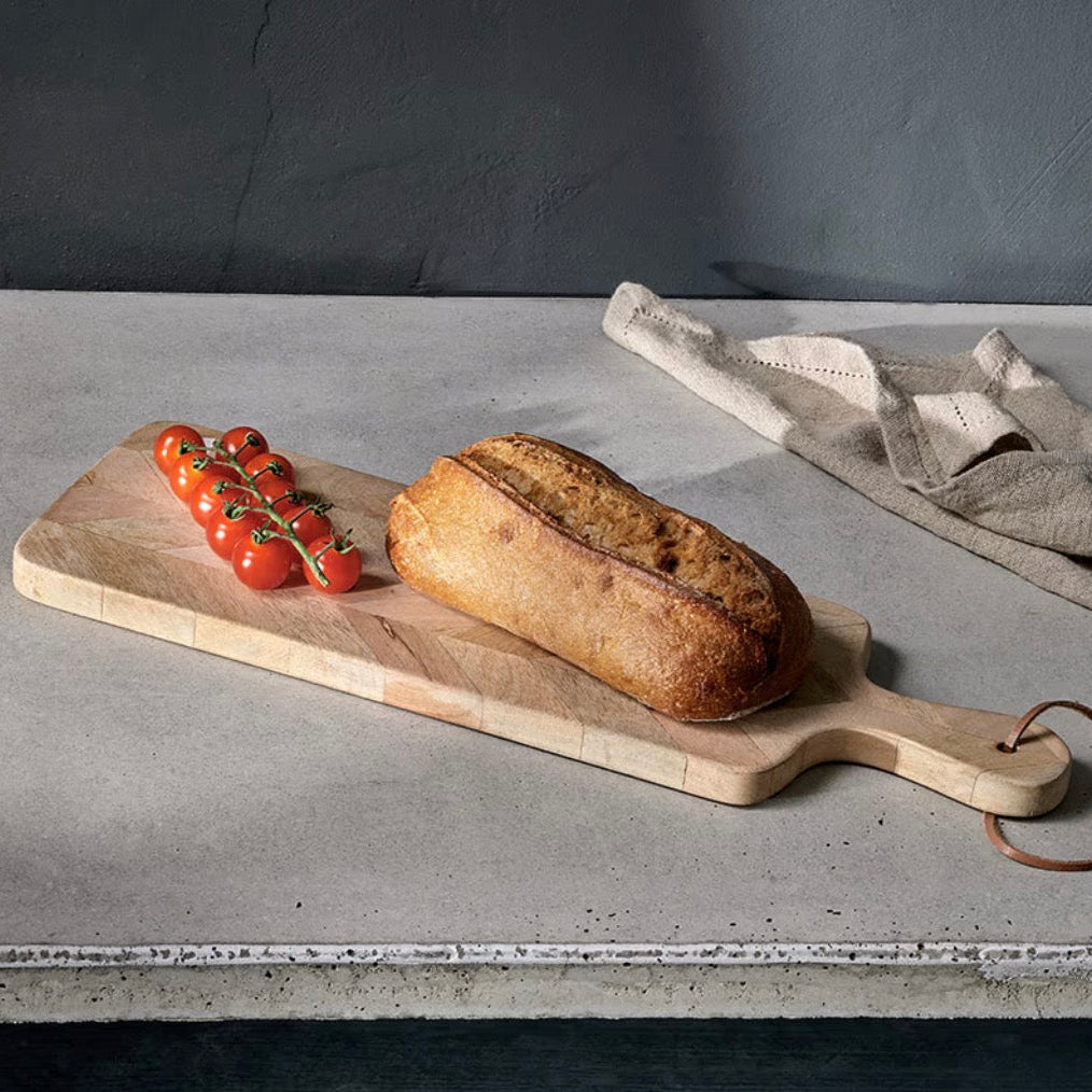 Nkuku Nalbari chopping board made of wood, featuring a smooth surface and natural grain, perfect for kitchen prep.