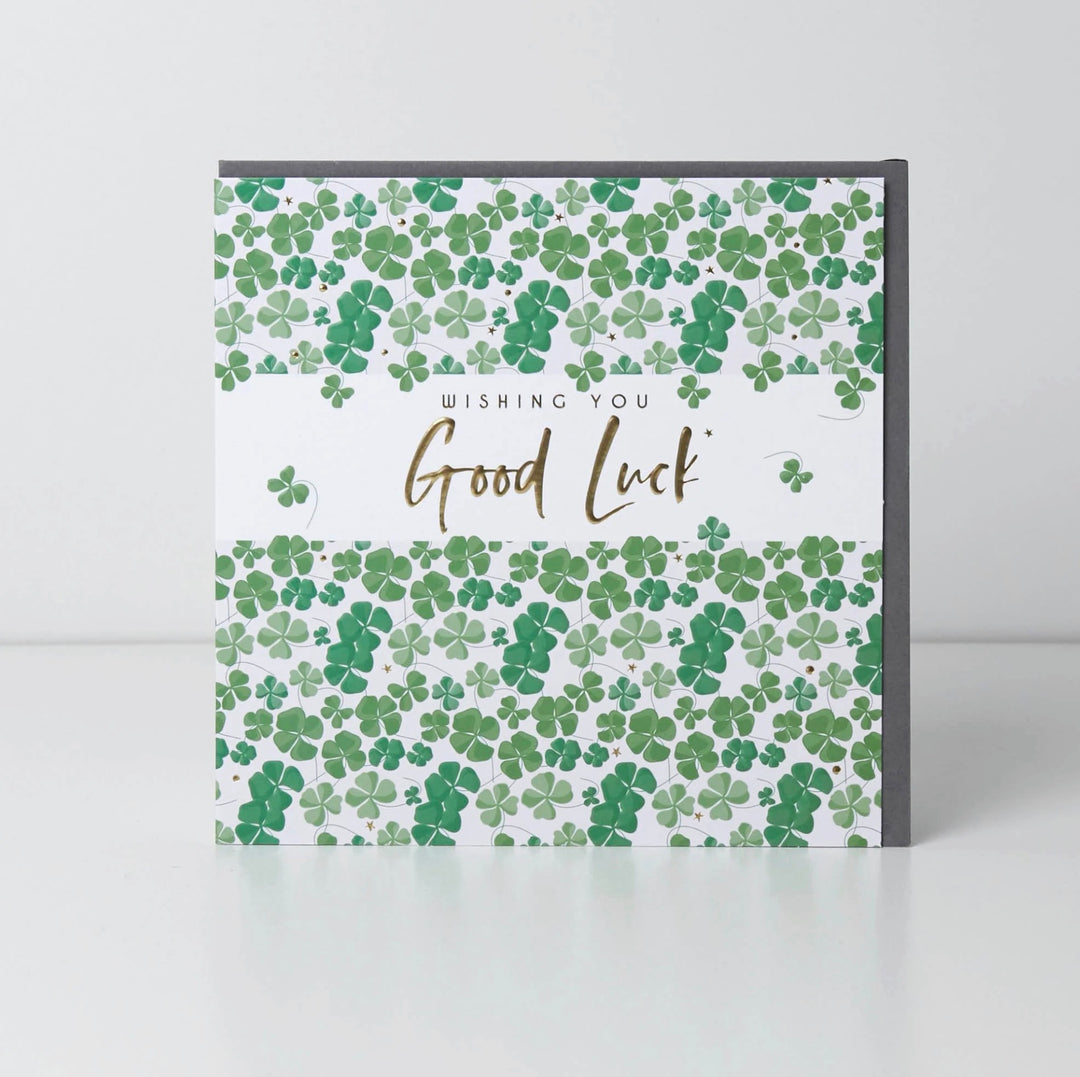 Belly button-shaped good luck card with decorative design, from Cornucopia Home and Gift, on a white background.