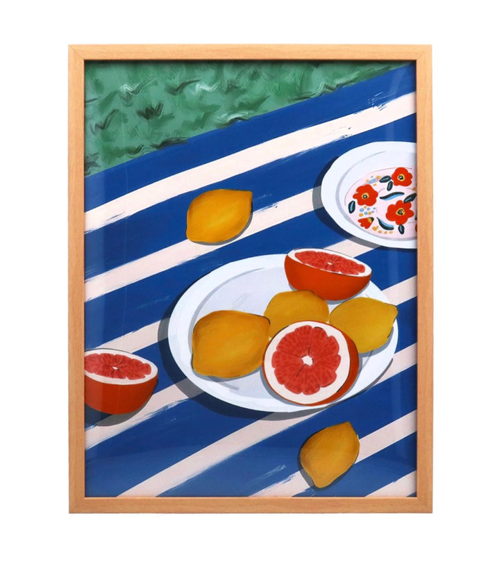 Gisela Graham large citrus plate framed print featuring vibrant lemon and orange illustrations on a white background.