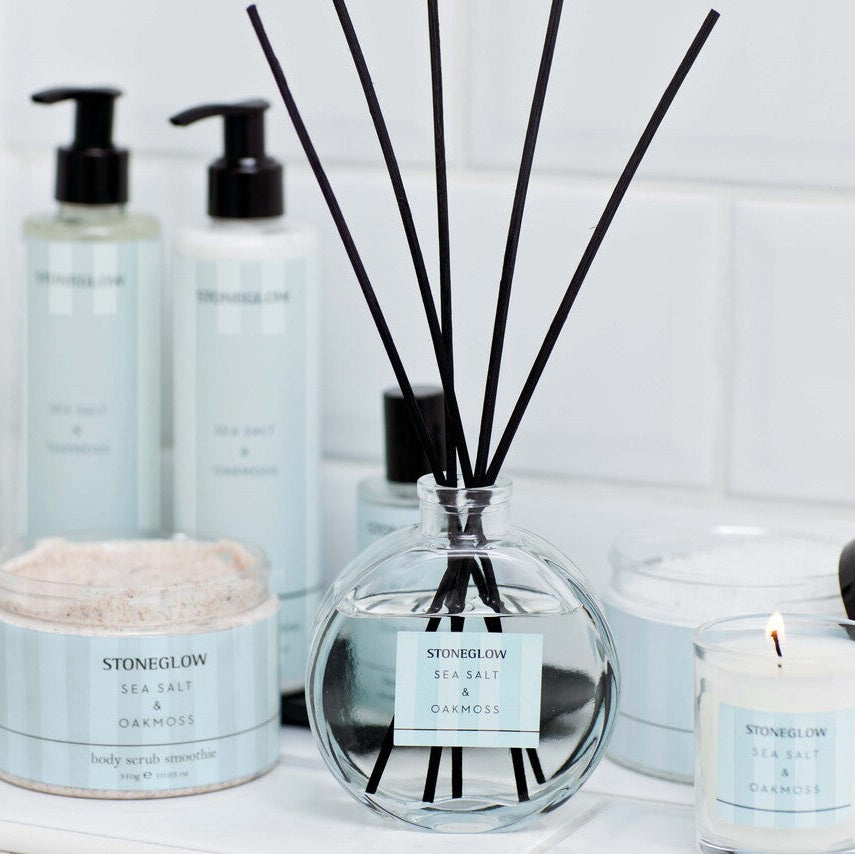 Stoneglow Modern Classics Sea Salt and Oakmoss reed diffuser in 120ml glass bottle, with decorative reeds and minimalist design.