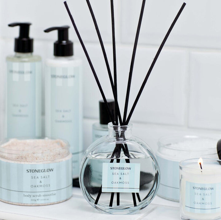 Stoneglow Modern Classics Sea Salt and Oakmoss reed diffuser in 120ml glass bottle, with decorative reeds and minimalist design.