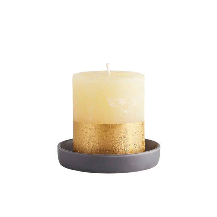 Small dark grey St Eval candle holder with a simple, rounded design for holding a tealight or small candle.
