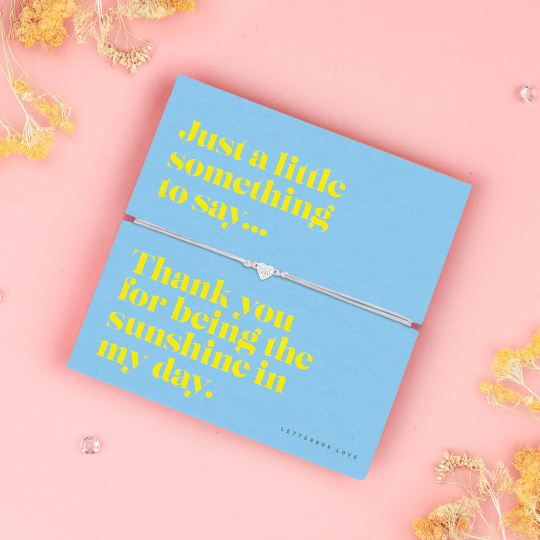 Sunshine Sentiment Bracelet from Cornucopia Home and Gift featuring a delicate letterbox love design in bright, cheerful yellow.