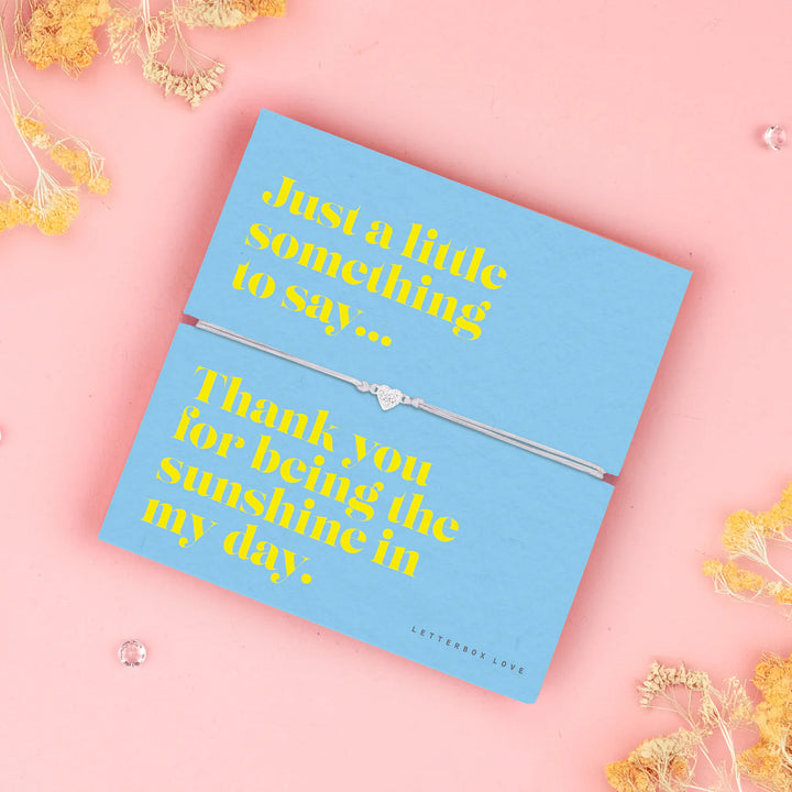 Sunshine Sentiment Bracelet from Cornucopia Home and Gift featuring a delicate letterbox love design in bright, cheerful yellow.
