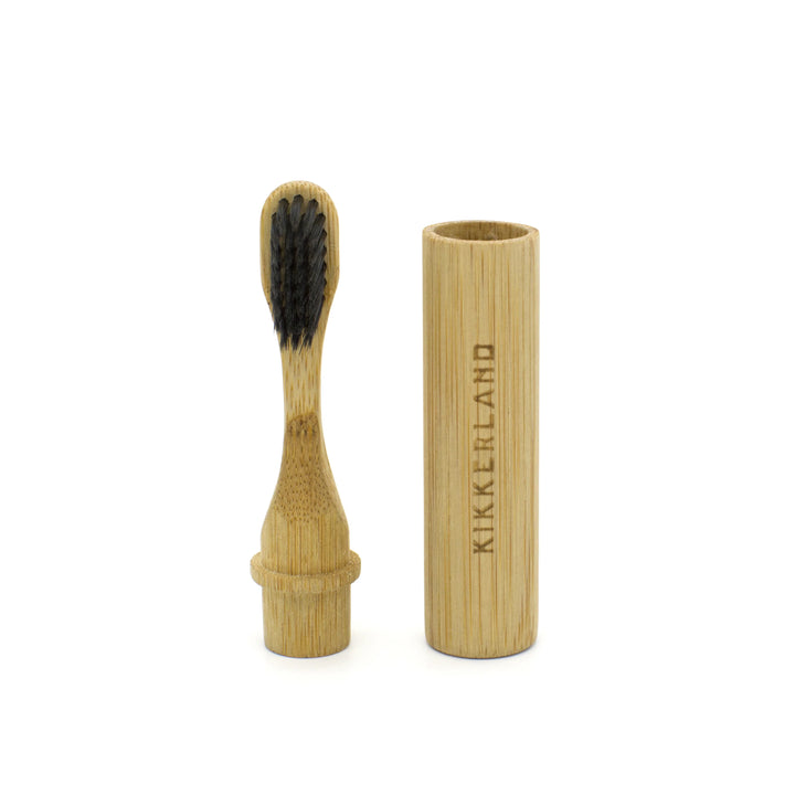 Kikkerland on-the-go bamboo toothbrush with biodegradable handle, suitable for travel and eco-friendly oral care.