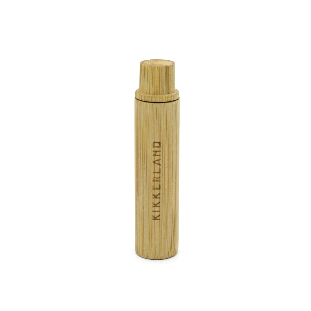 Kikkerland on-the-go bamboo toothbrush with eco-friendly design, featuring a biodegradable handle and compact travel case.
