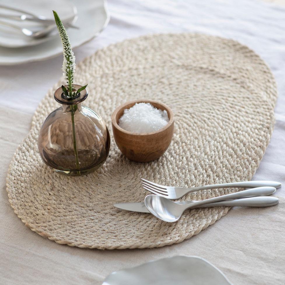 Pair of Jute table mats from Garden Trading by Cornucopia Home and Gift, showing natural woven jute texture on a table.